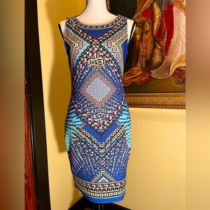 Peach Puff tribal body con dress from Bloomingdale’s. Size: Medium.